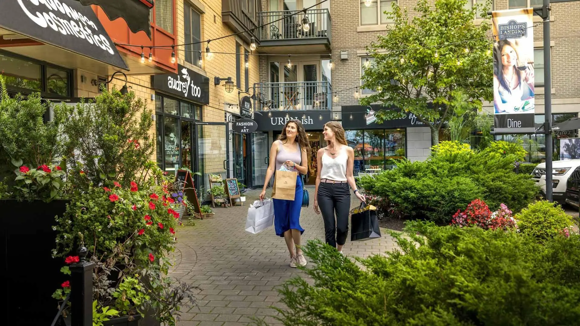 Two friends shopping in Bishop's Landing on the Halifax Waterfront in downtown Halifax, Nova Scotia